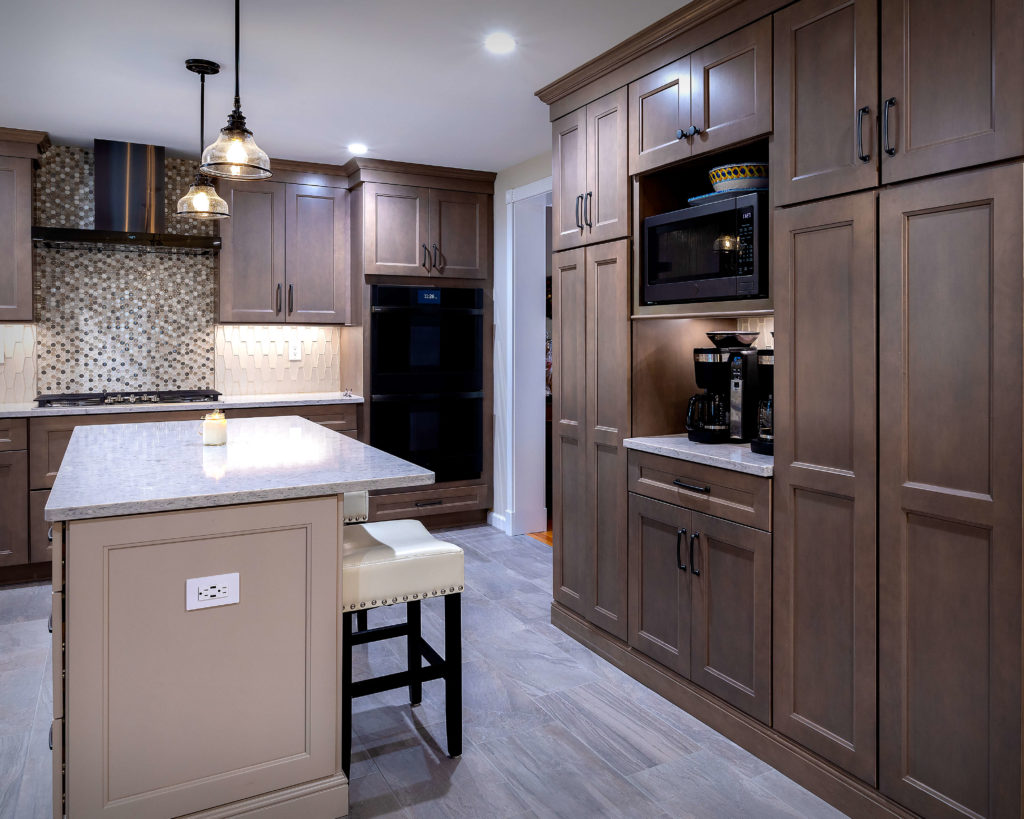 Full height cabinets flank a surpisingly useful coffee nook with his and hers coffee machines.