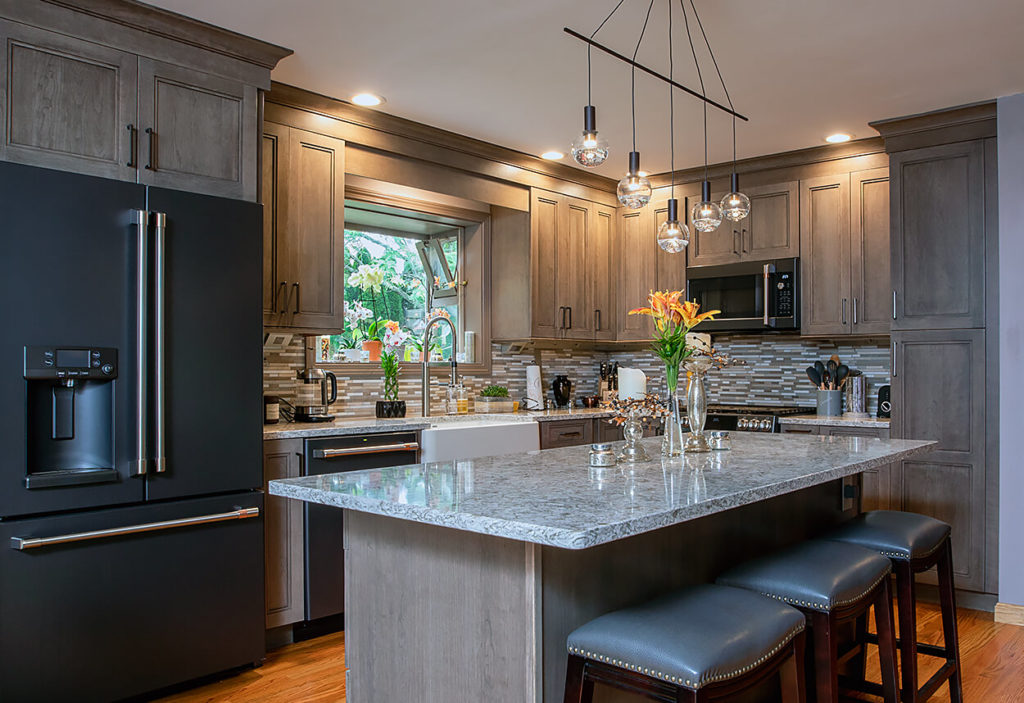 View of the island and perimeter cabinets AFTER work on this kitchen remodel in Wallingford, CT.