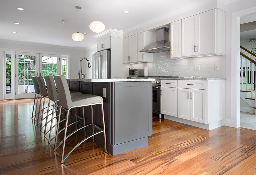 View of the Homecrest Sedona perimeter cabinets in Alpine Opaque and Galaxy Opaque for the island of this spacious West Hartford kitchen remodel.